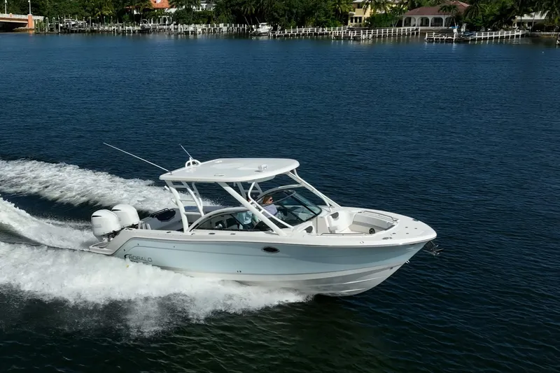  Yacht Photos Pics 2020 Robalo R317 Dual Console boat cruising on a serene waterway.