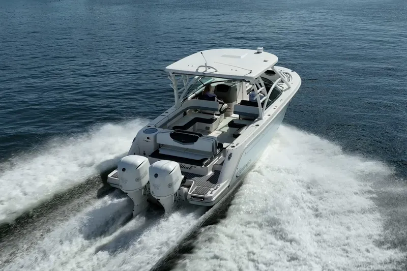  Yacht Photos Pics 2020 Robalo R317 Dual Console boat cruising on open water.