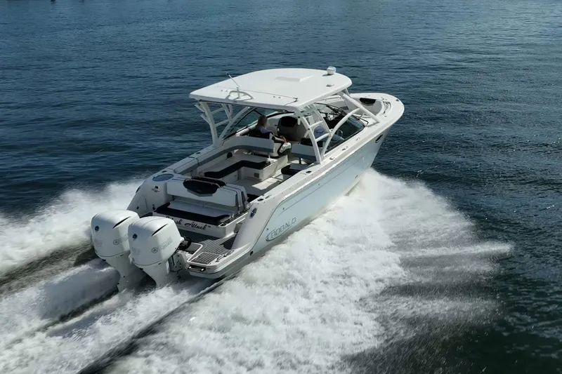  Yacht Photos Pics 2020 Robalo R317 Dual Console boat cruising on open water.