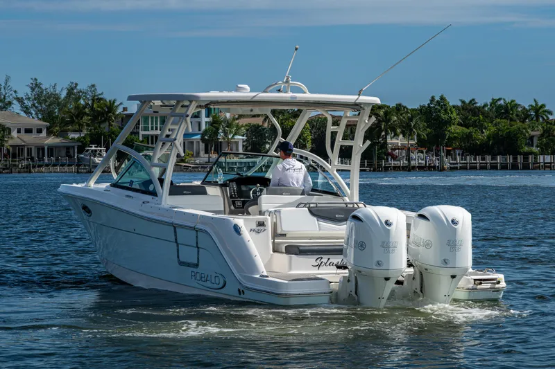  Yacht Photos Pics 2020 Robalo R317 Dual Console boat cruising on a sunny day.