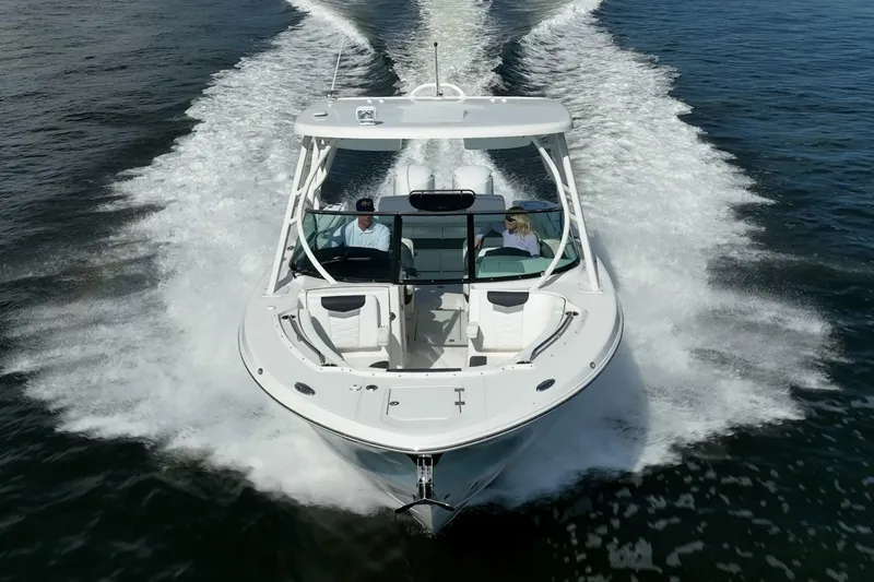  Yacht Photos Pics 2020 Robalo R317 Dual Console boat cruising on open water.