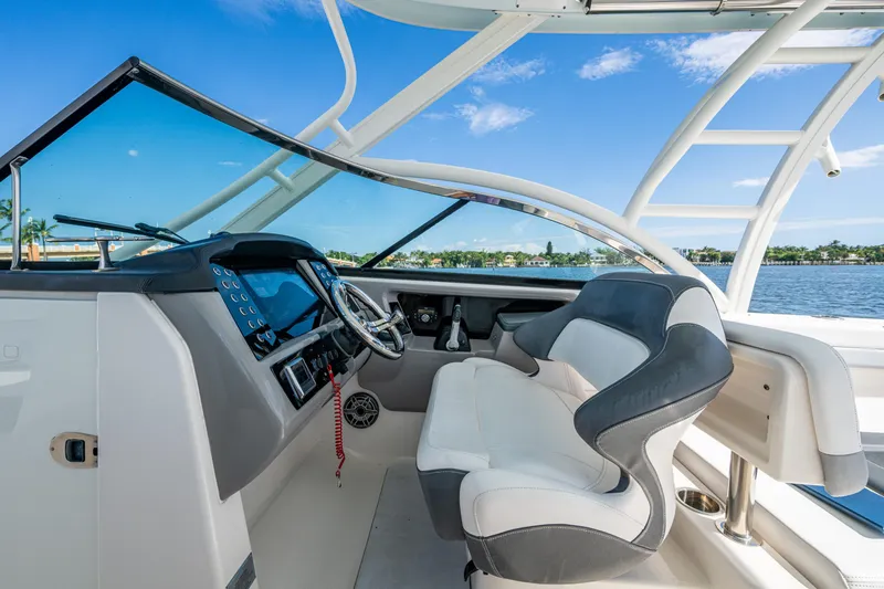  Yacht Photos Pics 2020 Robalo R317 Dual Console boat interior with steering wheel and seating.