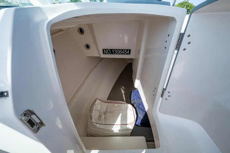  Yacht Photos Pics 2020 Robalo R317 Dual Console boat storage compartment interior view.