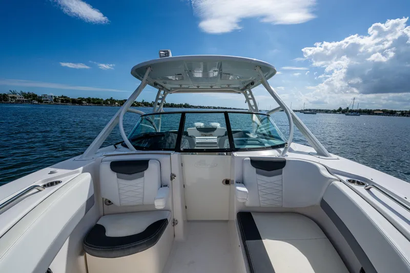  Yacht Photos Pics 2020 Robalo R317 Dual Console boat interior on a sunny day, with ocean view.