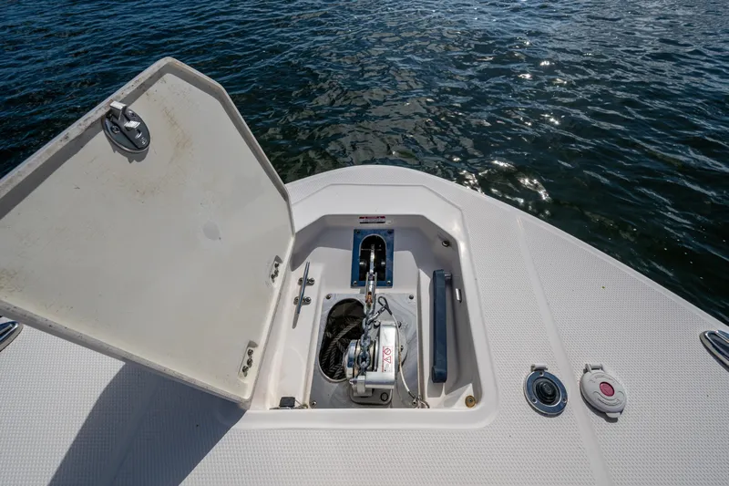  Yacht Photos Pics 2020 Robalo R317 Dual Console boat anchor compartment open on water.