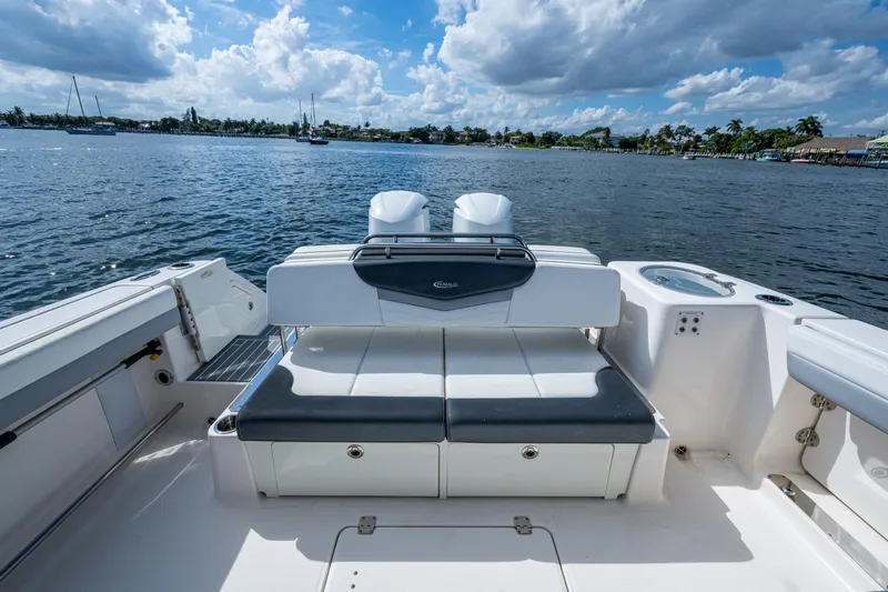  Yacht Photos Pics 2020 Robalo R317 Dual Console boat interior with seating, overlooking a scenic water view.