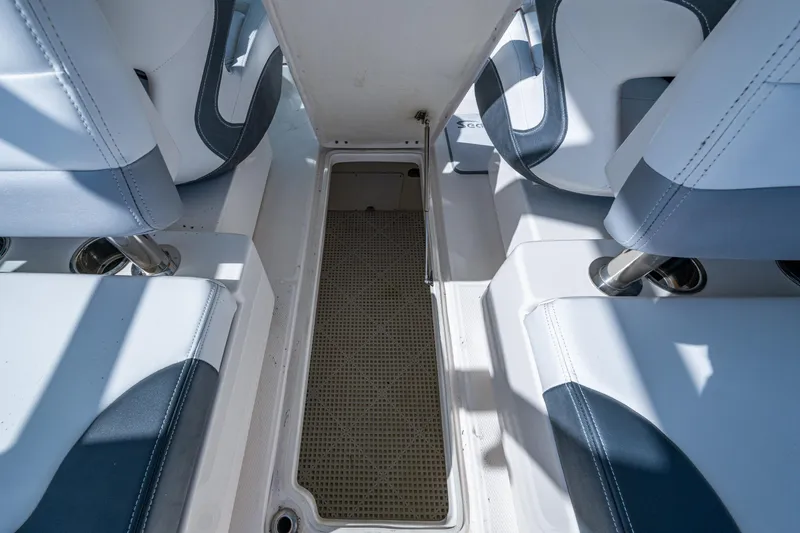  Yacht Photos Pics 2020 Robalo R317 Dual Console boat interior with seating and storage compartment.