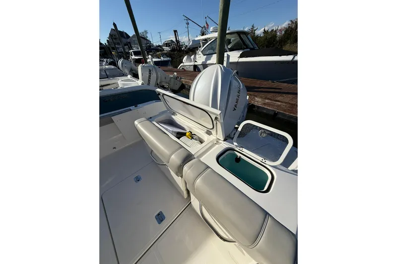  Yacht Photos Pics 2024 Pursuit DC 246 Dual Console boat with Yamaha engine and seating area.