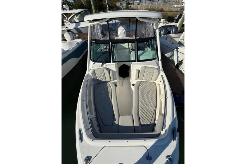  Yacht Photos Pics 2024 Pursuit DC 246 Dual Console boat with spacious seating and modern design.
