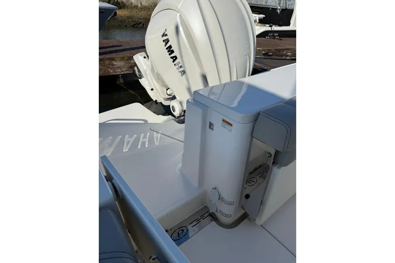  Yacht Photos Pics 2024 Pursuit DC 246 Dual Console boat with Yamaha engine, docked in sunlight.