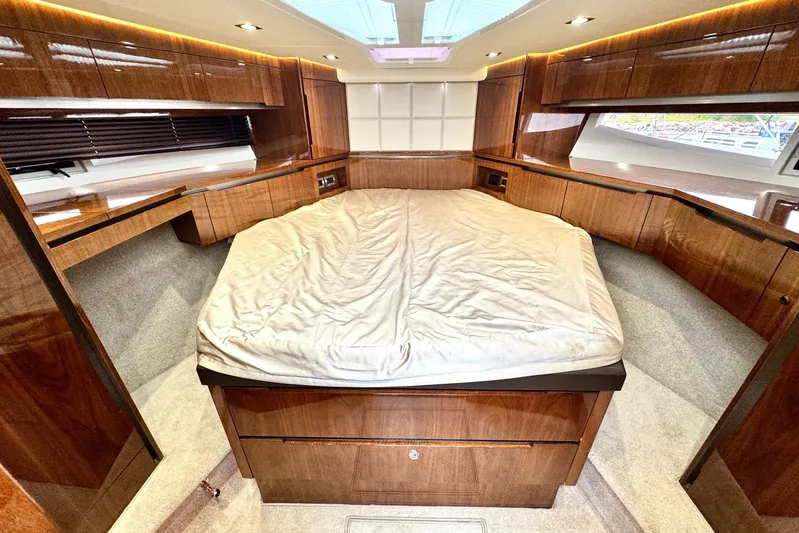  Yacht Photos Pics Luxurious interior of 2018 Galeon 470 Skydeck yacht with elegant wood finish.