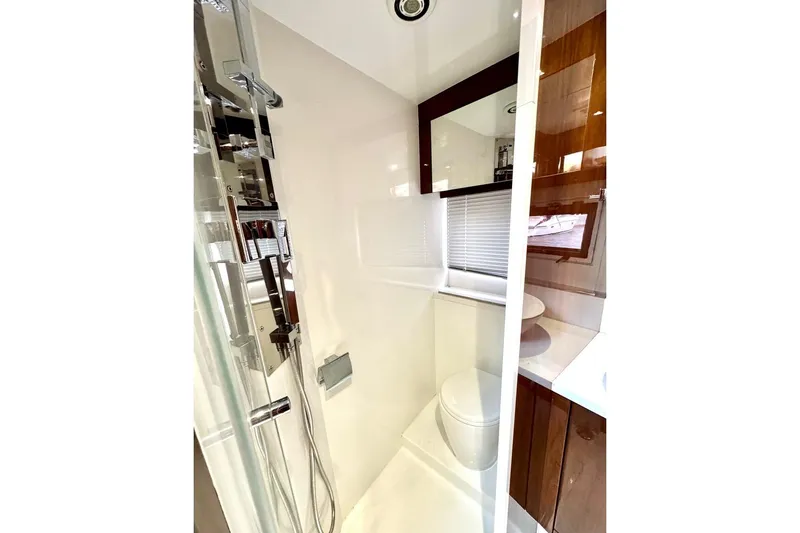  Yacht Photos Pics Luxurious bathroom in 2018 Galeon 470 Skydeck yacht with modern fixtures and sleek design.