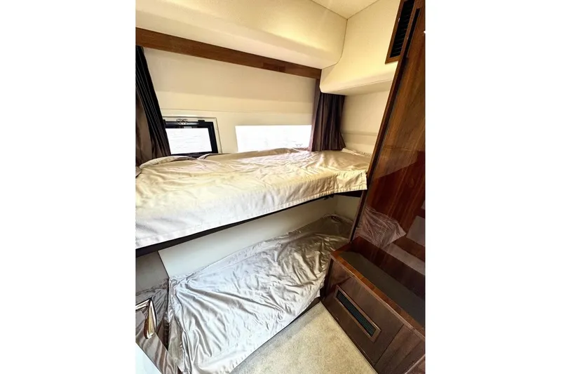  Yacht Photos Pics 2018 Galeon 470 Skydeck interior with cozy bunk beds and elegant wood finish.