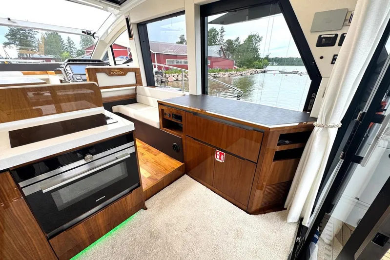  Yacht Photos Pics Interior of 2018 Galeon 470 Skydeck yacht with modern kitchen and scenic water view.