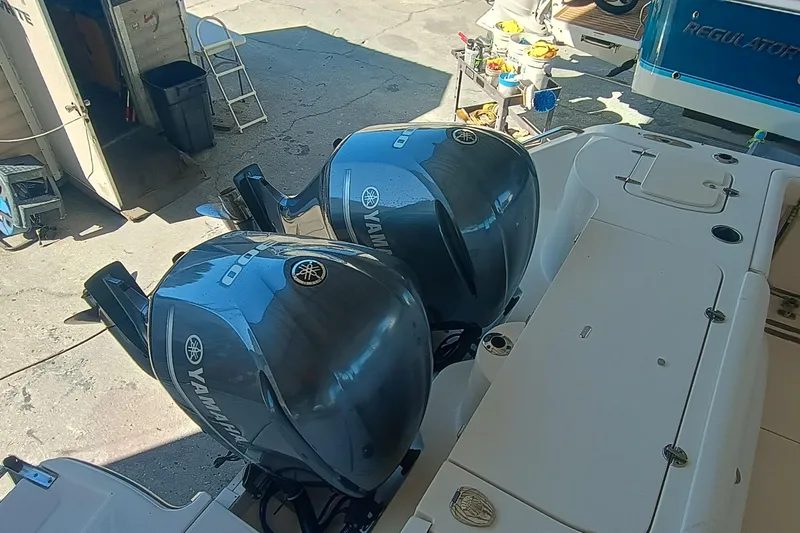 325-708 Brokerage Josh Yacht Photos Pics 2021 Grady-White Freedom 325 with dual Yamaha outboard engines in a marina setting.