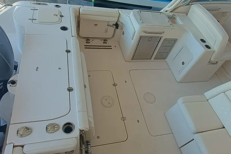 325-708 Brokerage Josh Yacht Photos Pics 2021 Grady-White Freedom 325 boat interior with seating and storage compartments.