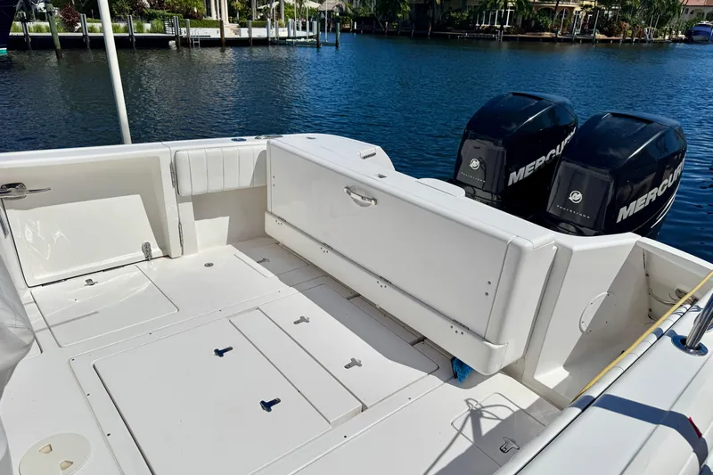  Yacht Photos Pics 2014 Intrepid 327 Center Console boat with dual Mercury engines on a sunny day.
