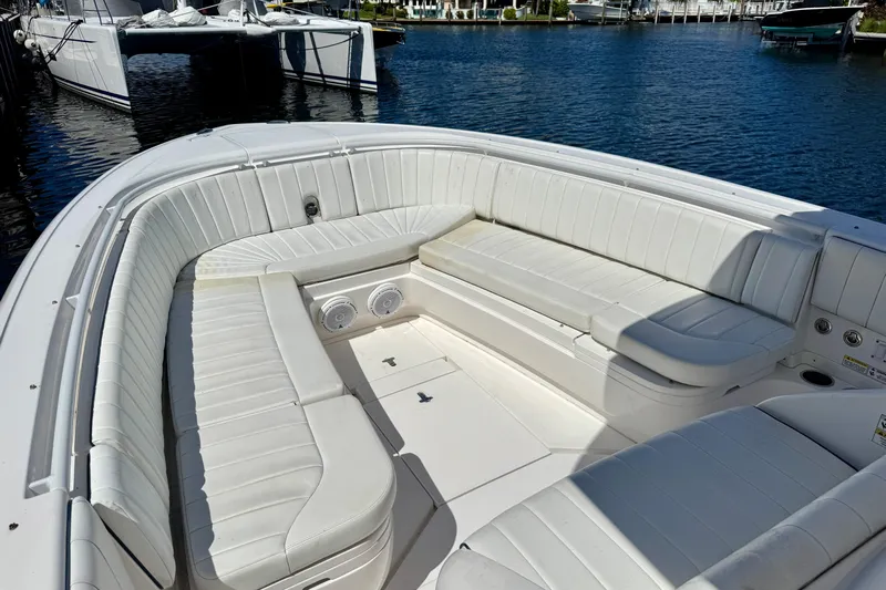  Yacht Photos Pics 2014 Intrepid 327 Center Console boat with spacious white seating area.
