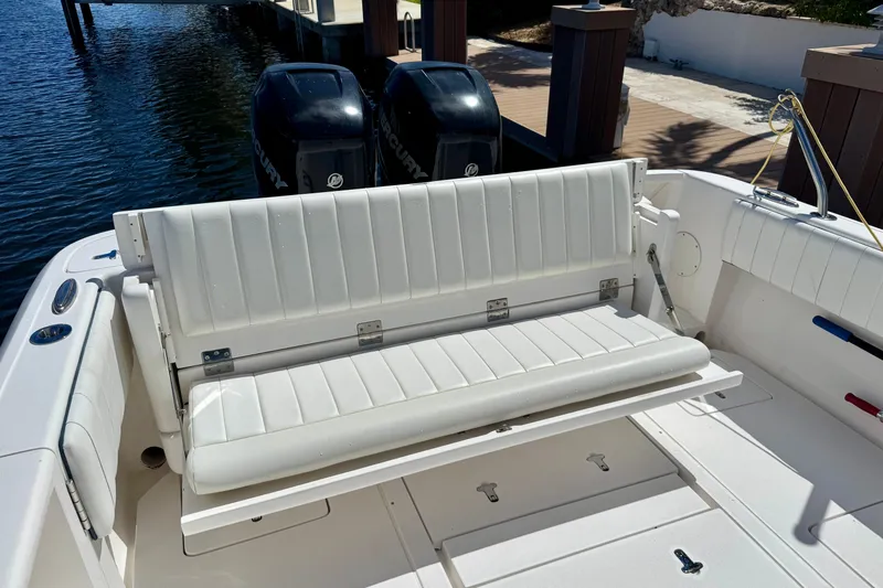  Yacht Photos Pics 2014 Intrepid 327 Center Console boat with white seating and dual Mercury engines.