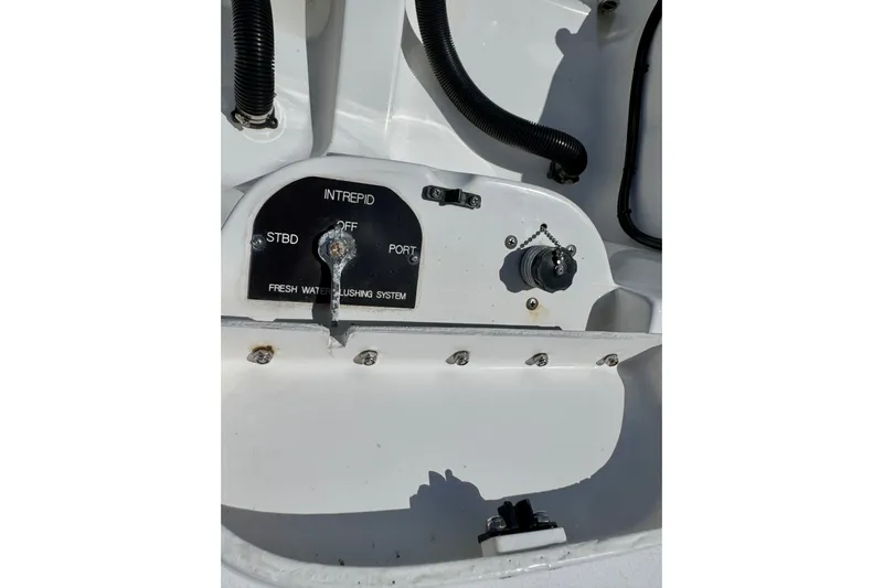  Yacht Photos Pics 2014 Intrepid 327 Center Console fresh water flushing system control panel.