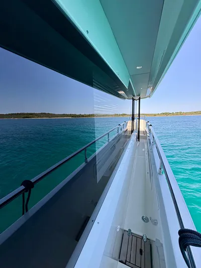  Yacht Photos Pics 2024 Absolute NAVETTA 52 yacht deck with ocean view and clear skies.