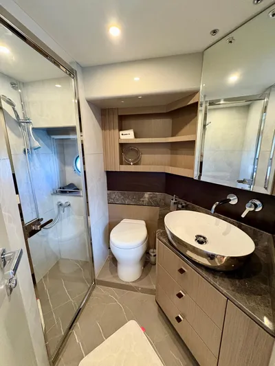  Yacht Photos Pics Luxurious bathroom in 2024 Absolute NAVETTA 52 yacht, featuring modern fixtures and elegant design.