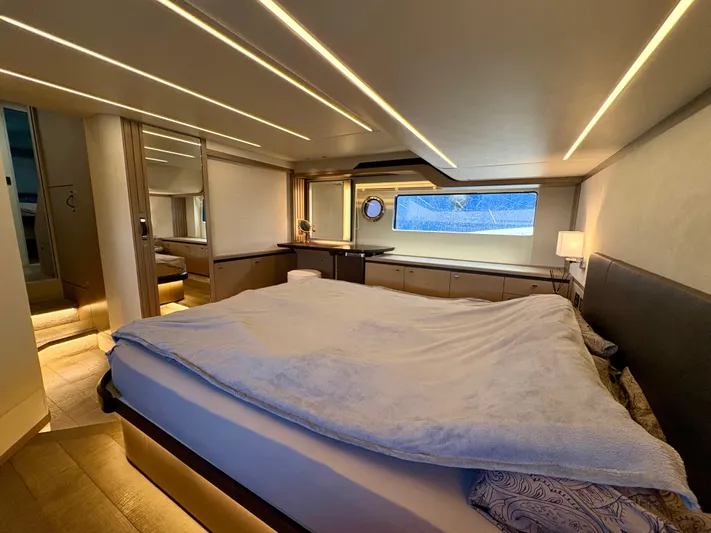  Yacht Photos Pics Luxurious bedroom interior of 2024 Absolute NAVETTA 52 yacht, featuring modern design and ambient lighting.