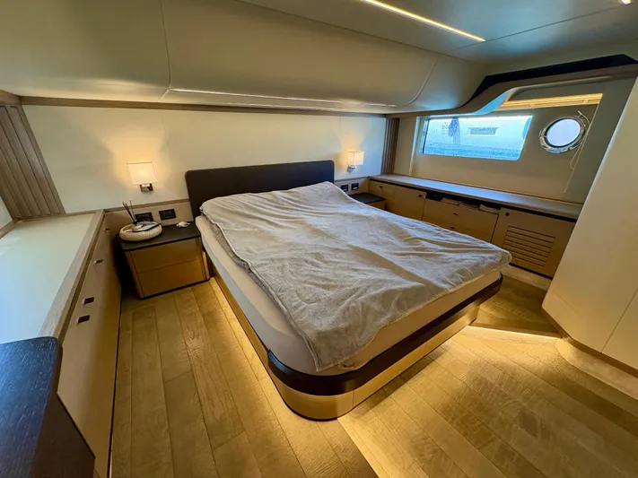  Yacht Photos Pics Luxurious bedroom interior of 2024 Absolute NAVETTA 52 yacht with modern design and ambient lighting.