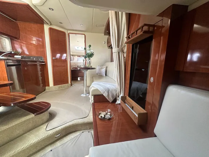 Salty Dawg Yacht Photos Pics Luxurious interior of a 2006 Sea Ray 380 Sundancer yacht with elegant wood finishes.