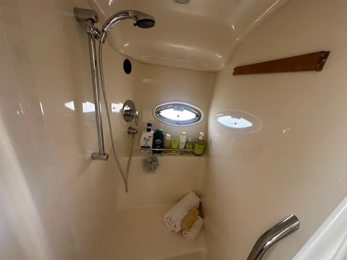 Salty Dawg Yacht Photos Pics Shower area in 2006 Sea Ray 380 Sundancer yacht with toiletries and towels.