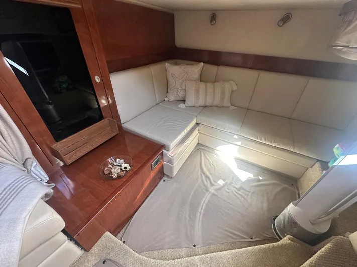 Salty Dawg Yacht Photos Pics Interior of 2006 Sea Ray 380 Sundancer with beige seating and wooden accents.