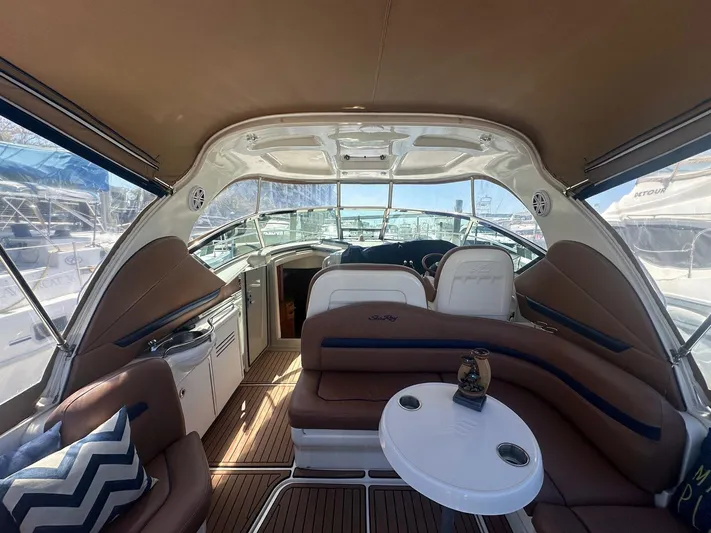 Salty Dawg Yacht Photos Pics Interior of 2006 Sea Ray 380 Sundancer yacht with seating and helm.
