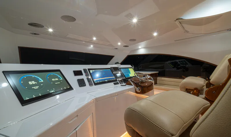  Yacht Photos Pics Luxurious 2022 Jarrett Bay Flybridge Express yacht interior with advanced navigation systems.