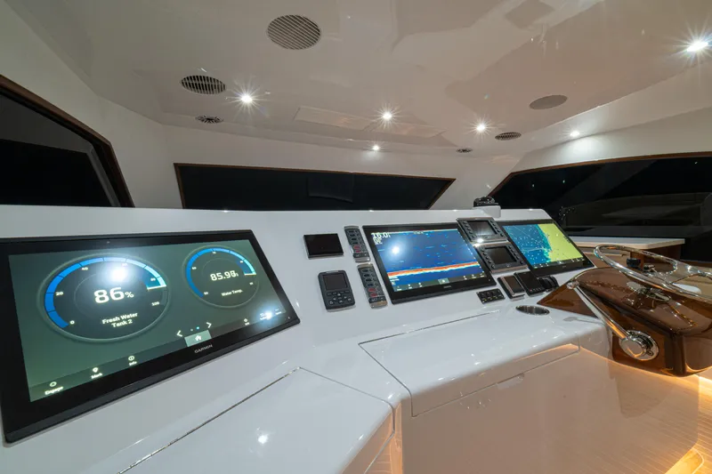  Yacht Photos Pics 2022 Jarrett Bay Flybridge Express helm with advanced navigation displays and controls.