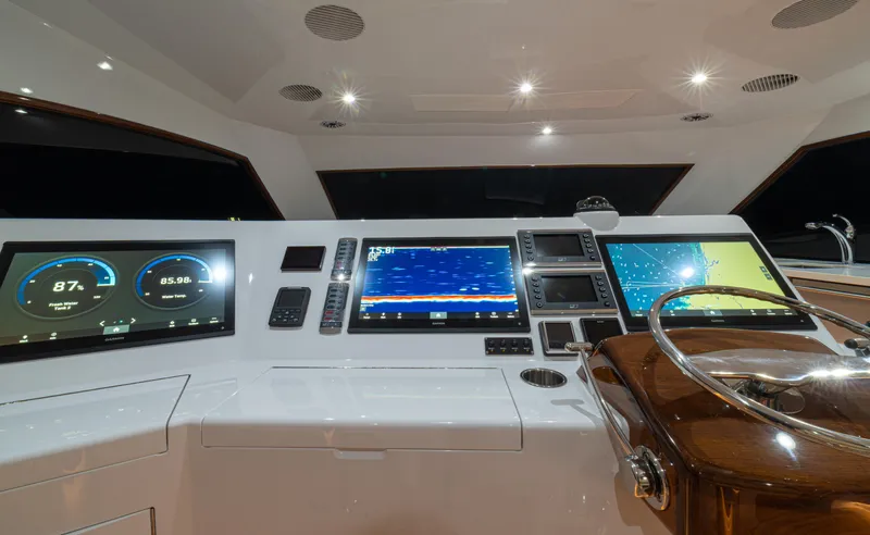  Yacht Photos Pics 2022 Jarrett Bay Flybridge Express helm with advanced navigation displays and controls.