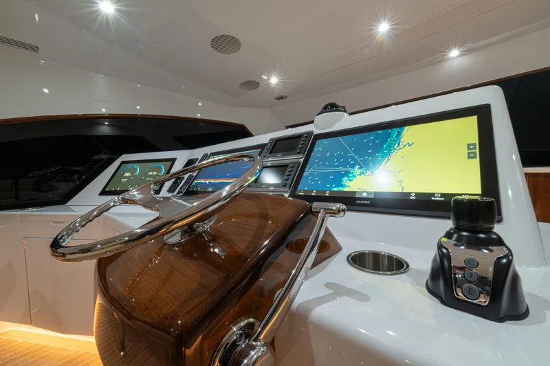  Yacht Photos Pics 2022 Jarrett Bay Flybridge Express helm with advanced navigation displays and controls.