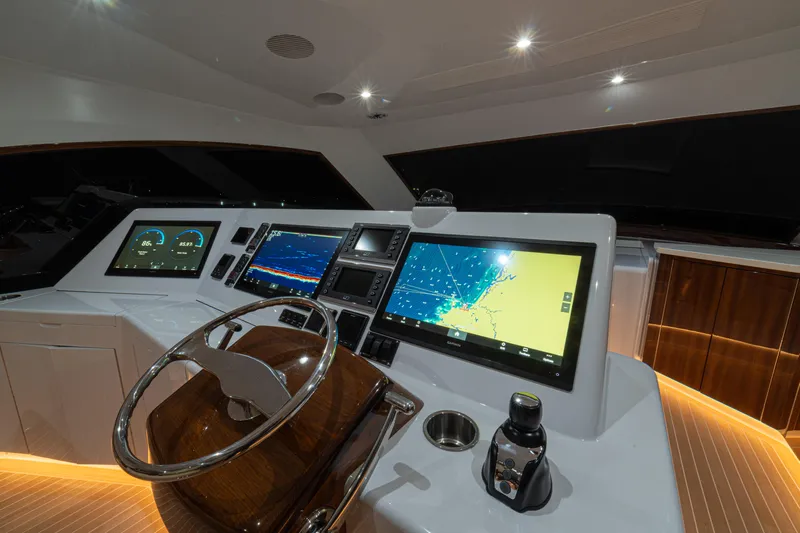  Yacht Photos Pics 2022 Jarrett Bay Flybridge Express helm with advanced navigation displays and controls.
