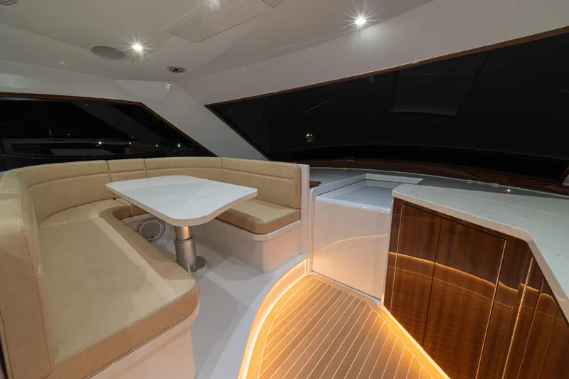  Yacht Photos Pics 2022 Jarrett Bay Flybridge Express interior with elegant seating and ambient lighting.