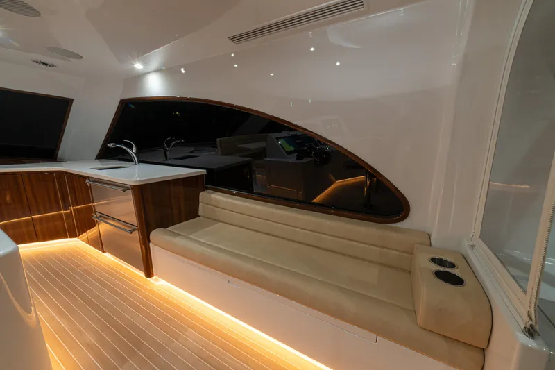  Yacht Photos Pics 2022 Jarrett Bay Flybridge Express interior with modern seating and ambient lighting.
