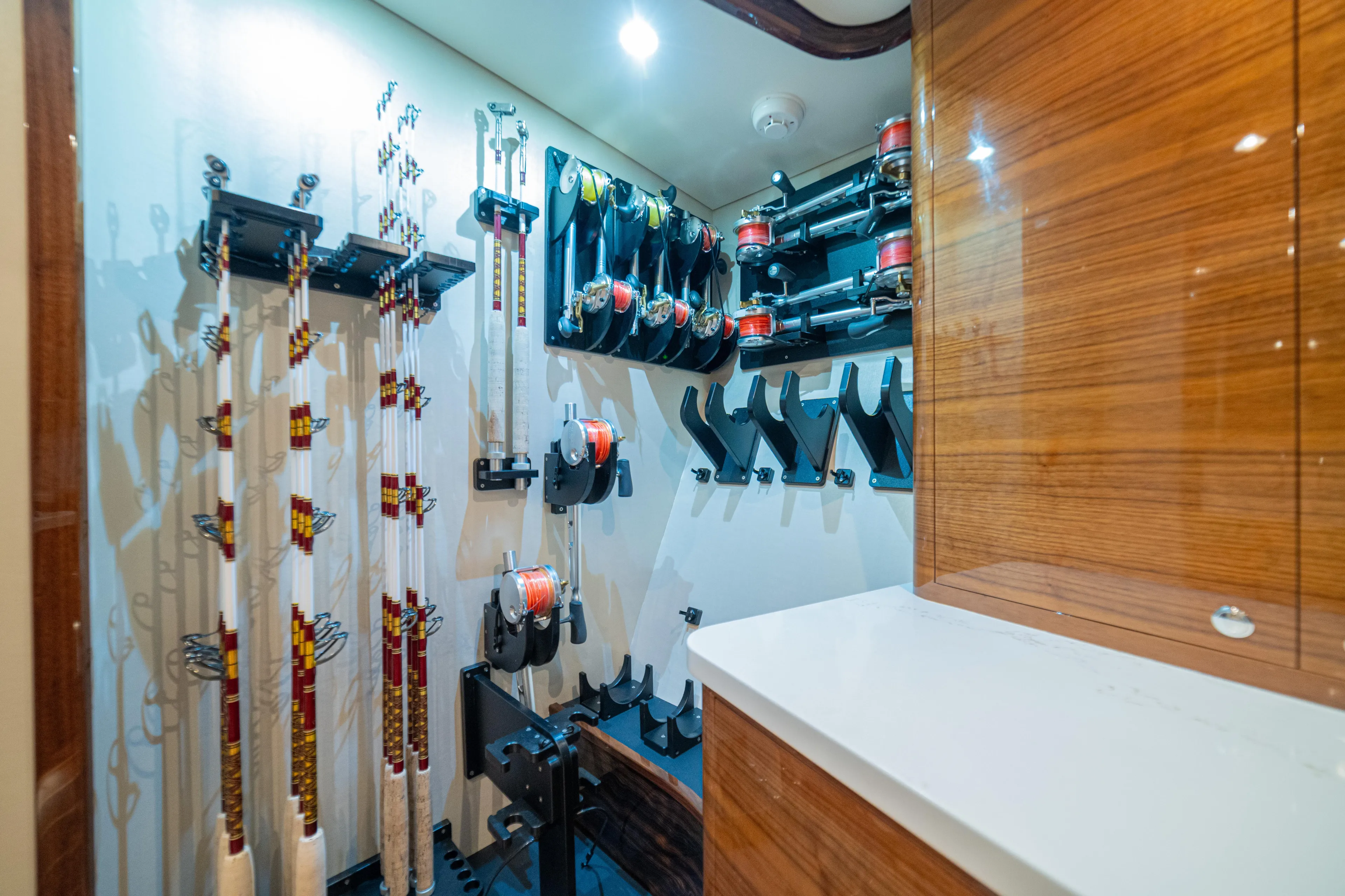  Yacht Photos Pics Fishing rod storage in 2022 Jarrett Bay Flybridge Express boat, featuring organized racks and reels.
