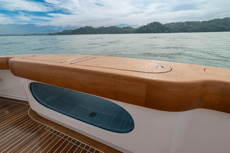  Yacht Photos Pics 2022 Jarrett Bay Flybridge Express boat deck with scenic water and mountain view.