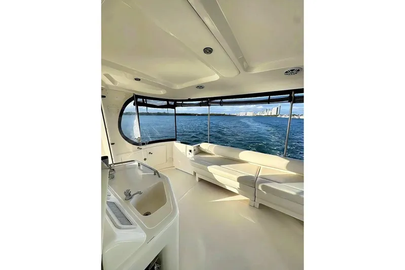  Yacht Photos Pics 2003 Sea Ray 390 Motor Yacht interior with ocean view and comfortable seating.