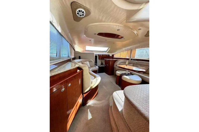  Yacht Photos Pics Luxurious interior of 2003 Sea Ray 390 Motor Yacht with elegant seating and wood finishes.