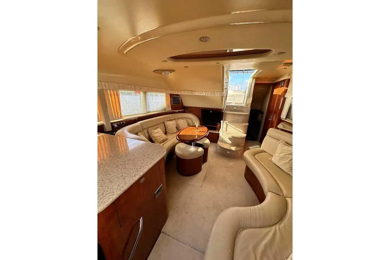  Yacht Photos Pics Luxurious interior of 2003 Sea Ray 390 Motor Yacht with plush seating and elegant design.