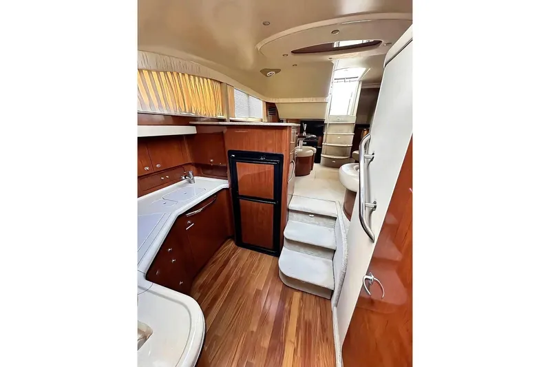  Yacht Photos Pics 2003 Sea Ray 390 Motor Yacht interior with modern kitchen and elegant wood finishes.