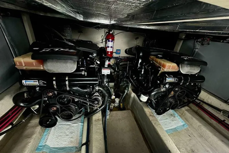  Yacht Photos Pics Engine room of 2003 Sea Ray 390 Motor Yacht with dual engines and fire extinguisher.
