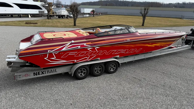  Yacht Photos Pics 2007 Fountain 42 Lightning speedboat on trailer, red with bold graphics, parked outdoors.