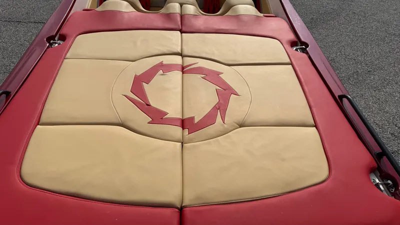  Yacht Photos Pics 2007 Fountain 42 Lightning boat interior with red and beige upholstery featuring a circular design.