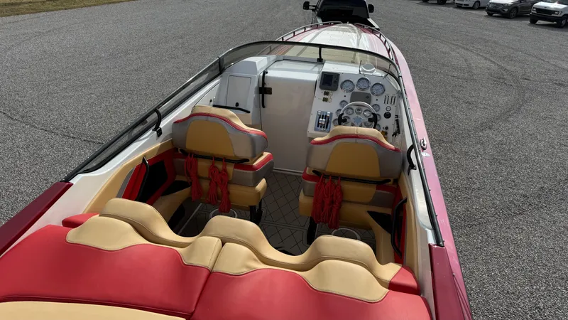  Yacht Photos Pics 2007 Fountain 42 Lightning boat interior with red and beige seating, dashboard view.