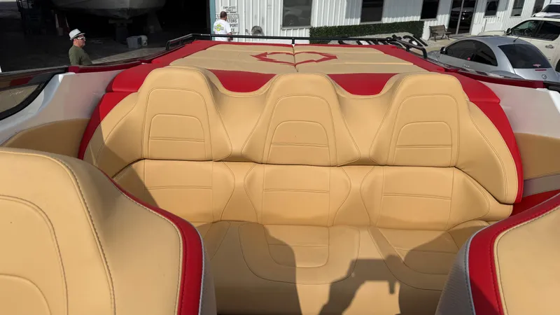  Yacht Photos Pics 2007 Fountain 42 Lightning boat interior with beige and red seating.